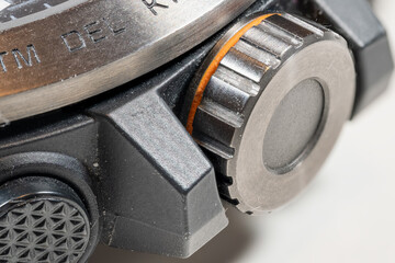 Macro view of the rotating button on a watch.