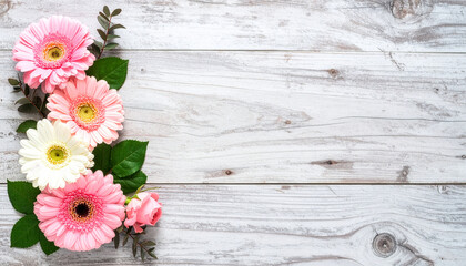 Fototapeta premium Pink and white gerbera daisies flower frame on white wooden background