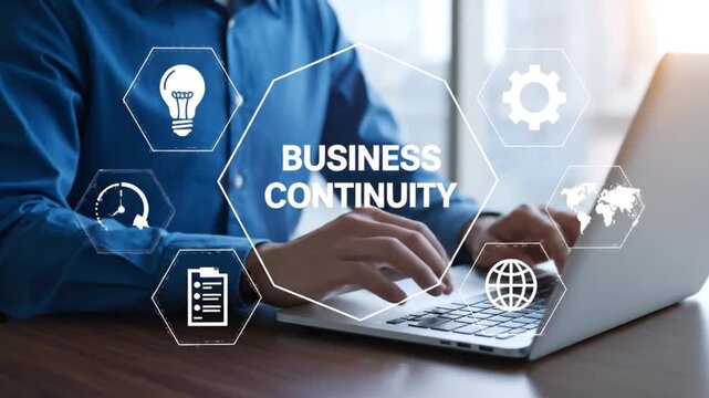 Businessman working on laptop with business continuity concept