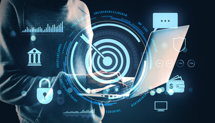 Person using laptop with digital target and cybersecurity icons on dark background symbolizing data protection and financial technology concept.