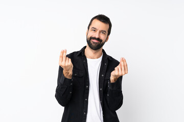 Fototapeta premium Young man with beard over isolated white background making money gesture