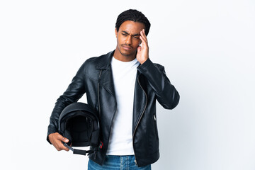 Fototapeta premium African American man with braids holding a motorcycle helmet isolated on white background with headache