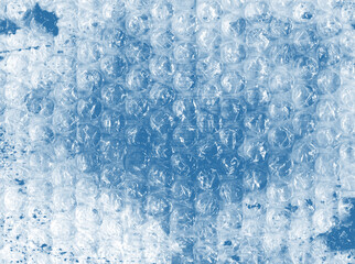 Creative bubble wrap texture &mdash; airy blue watercolor background in cloudy, sky tones. Transparent plastic bubbles &mdash; abstract mixed media composition for music covers, album art, contemporary design