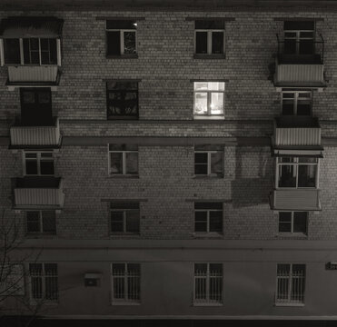 lonely lighted window at night