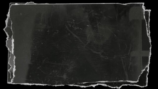 The black and white texture, with its numerous scratches, graininess, and dirt, is reminiscent of old film photographs and weathered paper. The cracks and graininess effects are particularly striking.