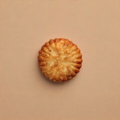 Top View of Single Round Golden Brown Shortbread Cookie on Minimalist Beige Surface