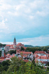 Fototapeta premium Famous Cesky Krumlov Castle tower and historic fortress architecture under blue sky in Bohemia, Czech Republic