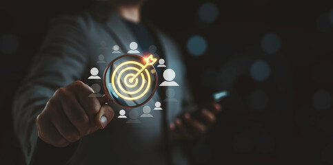 Target audience concept with magnifying glass and target icon highlighting customer focus for precision marketing, audience segmentation, business growth strategy and data driven decision making.