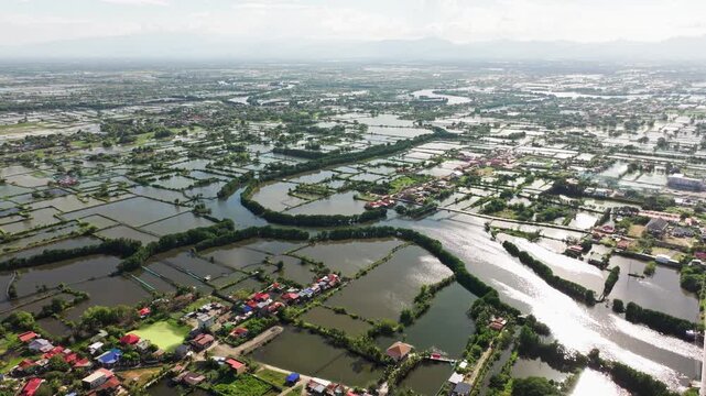Aerial of flooded river and fishponds near Dagupan Pangasinan Philippines