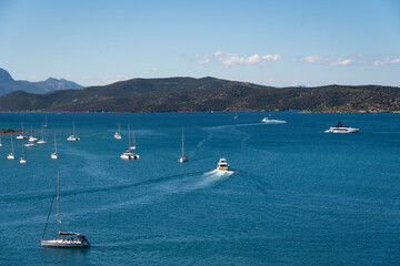 Poros Island bay and harbor view with traditional seaside town and calm Mediterranean waters, Greece.