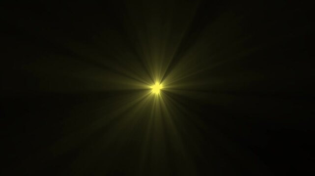 Abstract loop center flickering glow yellow star optical shine light lens flares animation. Spotlight rays abstract animation on black background. sun beam overlay...