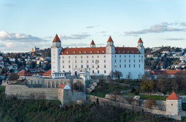 Obraz premium Bratislava castle on the hill over Danube river after sunset in the Bratislava old town, capital of Slovakia