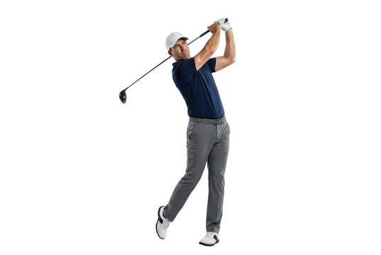 Full length male golfer in navy polo and gray pants swinging driver golf club, isolated on white background
