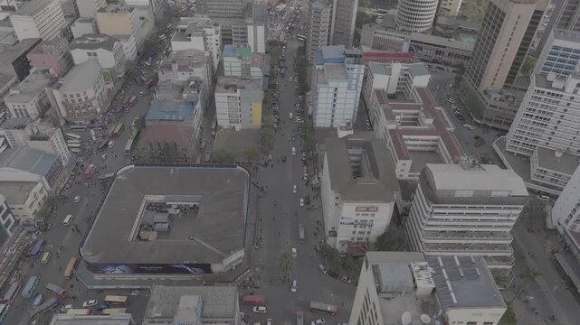 Aerial drone shot of Nairobi central business district with traffic and people moving about during the day.