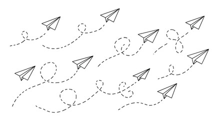 Obraz premium Set of paper planes flying in different directions with dotted lines indicating their motion and flight paths on a white background.