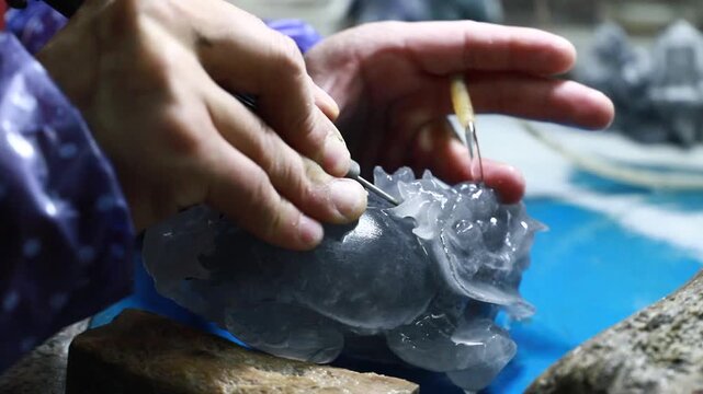 Artisan Hand Carving Crystal Stone with Precision Tools