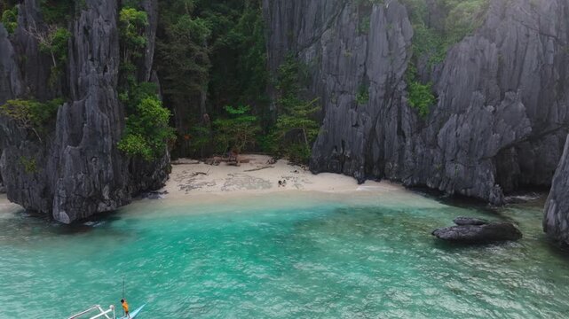Island hopping moment shows beach solitude, Bacuit Bay Sulu Sea, Philippines