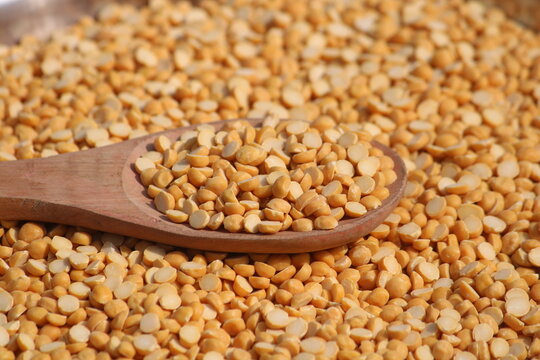 Toor dal is known as tur daal, yellow lentils split peas, indian split pigeon peas, arhar dal, tuvar dal, split peas, Yellow lentils, arahar daal, indian pulses. Concept of vegetarian protein food