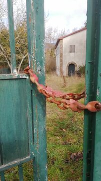 Old rusty chain, closing a gate
