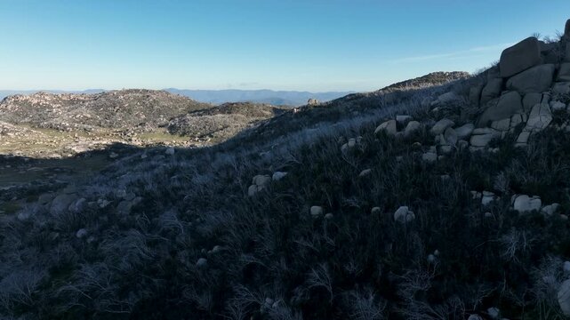 Drone Revealing the Beauty of White Trees, Giant Rocks & Majestic Mountains