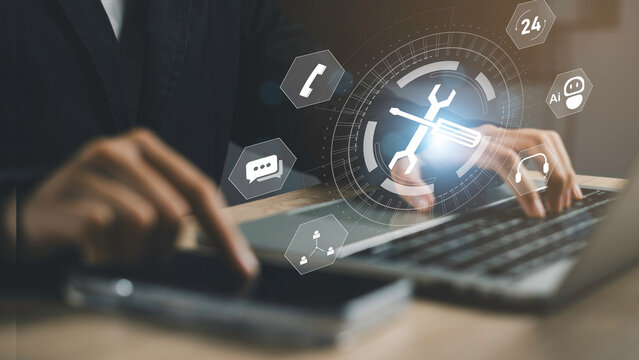 Businessman using laptop and smartphone with digital tool and AI icons, Online support services, system maintenance, help desk solutions, and client-focused technology repair and assistance.