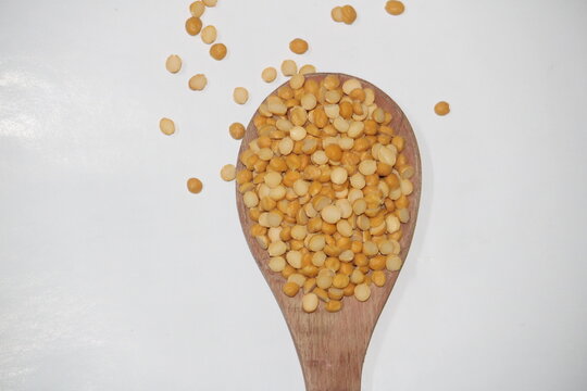 Toor dal is known as tur daal, yellow lentils split peas, indian split pigeon peas, arhar dal, tuvar dal, split peas, Yellow lentils, arahar daal, indian pulses. Concept of vegetarian protein food