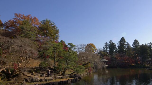 Peaceful Naritasan Park scene with Ryuchi Pond and Ukimido pavilion