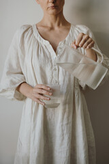 Minimalist Hydration Lifestyle With Hands Pouring Drinking Water From Pitcher Into Glass