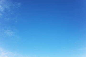 Blue sky background and white clouds soft focus, and copy space horizontal shape.