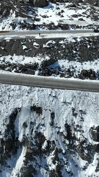 Los Caracoles highway road near Santiago Chile in aerial view. Snow highway road. Vertical video