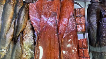 Cold smoked chum salmon and other smoked fish on display in market  