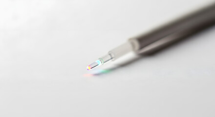 Fototapeta premium A close-up view of a pen tip on a plain surface, highlighting the precision of writing instruments