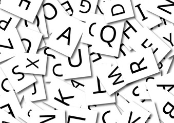Scattered alphabet letter cards symbolizing language,