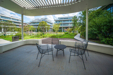 Tranquil Outdoor Lounge Space Amidst Modern Architectural Marvels