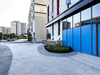 Modern Architectural Design Featuring Curved Pathway and Glass Facade