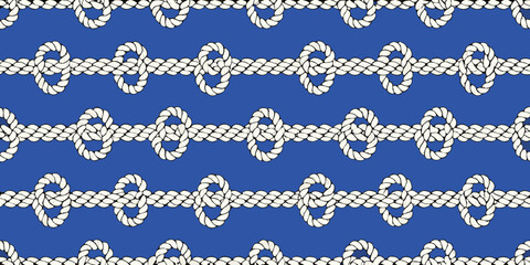 Fototapeta premium Repeating pattern of white ropes and knots on a vibrant blue background