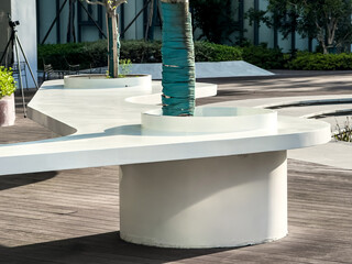 Contemporary Outdoor Design Featuring Curved Furniture and Lush Greenery