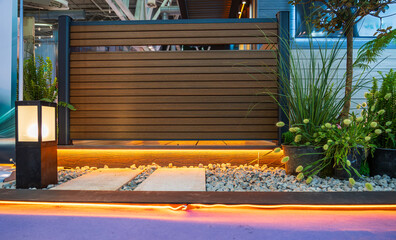 Elegant Outdoor Entrance with Modern Lighting and Lush Plant Life