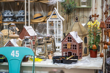 Charming Vintage Home Decor Display Featuring Unique Lanterns and Whimsical Birdhouses