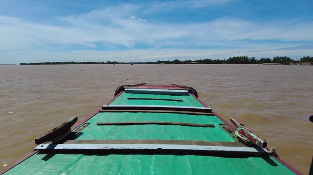 Asia, Vietnam, Mekon Delta River 02,08,2026 - tourists tour the river on traditional wooden slow boats and visit the islands attractions of the river - day experience from Saigon in the waters of sout