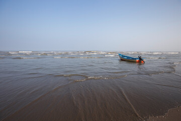 Small Fishing Boat Floating Near Shoreline
Lonely Wooden Boat On Calm Sea Under Clear Sky