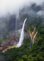 Majestic Nohkalikai Falls Plunging Down Cliff into Deep Pool, Highest Waterfall in Cherrapunji Meghalaya Shrouded in Monsoon Mist © suparna