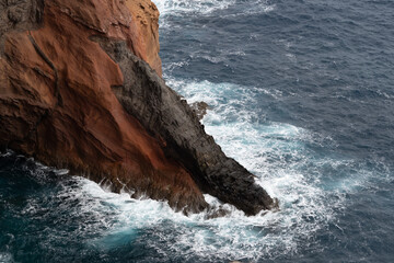 Photo of rocky cliffs along the Atlantic Ocean in Madeira, Portugal, showcasing dramatic coastal landscapes and natural rugged scenery