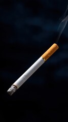 Single Cigarette Illuminated with Smoke on Dark Background in Artistic Composition