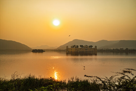 Sunset over Jal Mahal lake palace in Jaipur.
