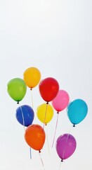 Obraz premium A vibrant collection of colorful party balloons gently drifting upward against a bright, clear background, signifying joy and festive occasions ,lightness ,festive ,party