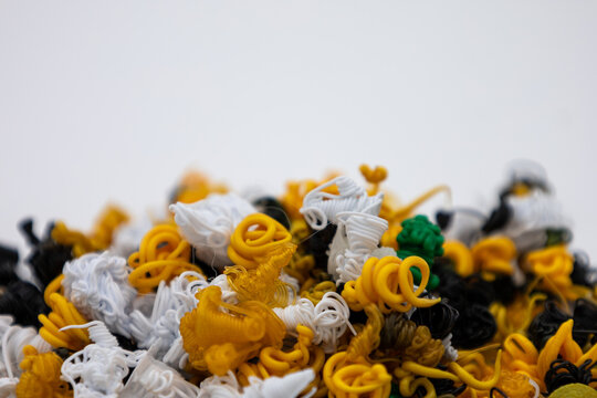 Close up of colorful 3D printing waste pieces