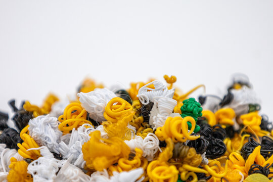 Close up of colorful 3D printing waste pieces