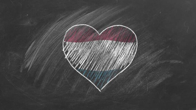 National flag of Netherlands in heart shape  drawn with colored chalk on a blackboard.