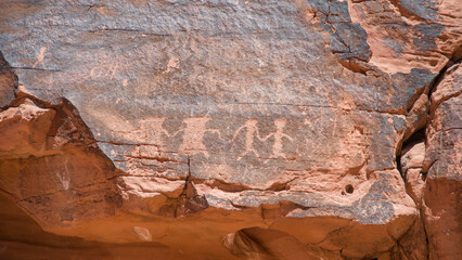 Ancient Petroglyphs on Sandstone Wall